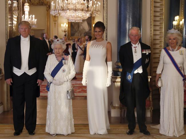 Donald Trump with the Queen, Melania, Prince Charles and Camilla. Picture: AP