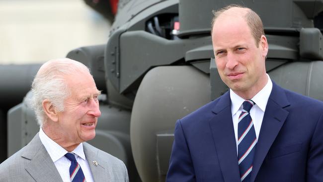 STOCKBRIDGE, HAMPSHIRE - MAY 13: King Charles III and Prince William, Prince of Wales share a joke during the official handover in which King Charles III passes the role of Colonel-in-Chief of the Army air corps to Prince William, Prince of Wales at the Army Aviation Centre on May 13, 2024 in Stockbridge, Hampshire. (Photo by Chris Jackson/Getty Images)