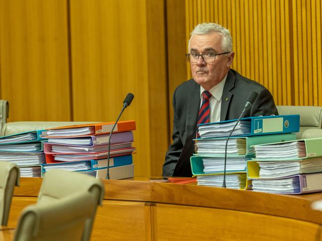 Andrew Wilkie sitting among the Hillsong financial documents he tabled in federal parliament. Picture: NCA NewsWire