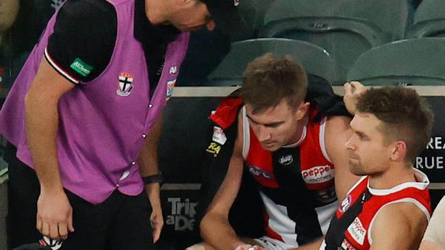 Dougal Howard is consoled by Butler after being subbed out of the match. Picture: Michael Willson/AFL Photos via Getty Images