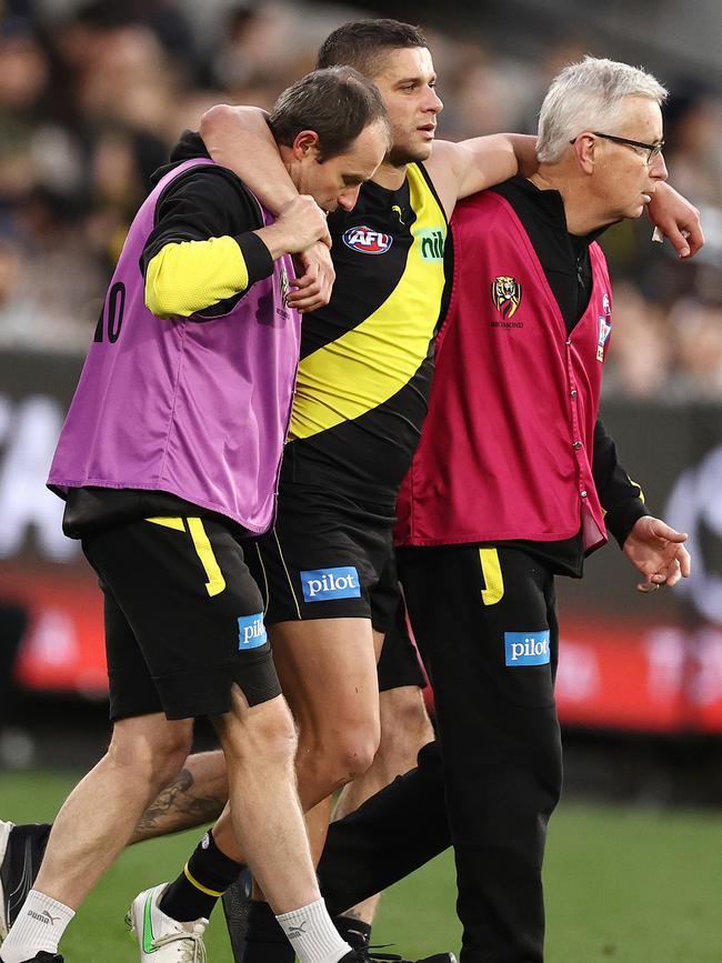 A groggy Prestia is helped from the field. Picture: Photo: Michael Klein