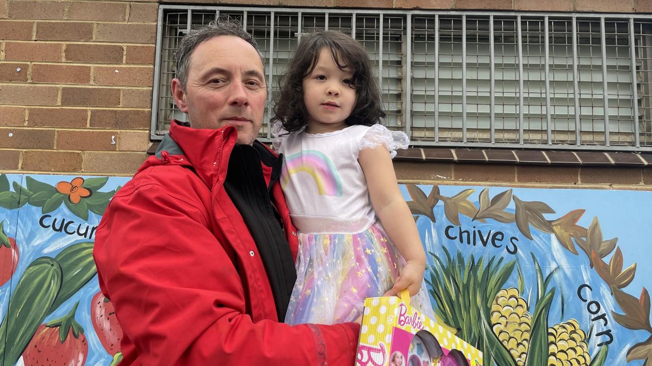 Voter Paul Swainson, 47, with his daughter Kelsey at Granville Public School polling booth.