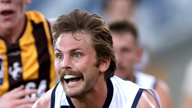 GEELONG, AUSTRALIA - FEBRUARY 23: Tom Atkins of the Cats handballs during the AFL Match Simulation between Geelong Cats and Hawthorn Hawks at GMHBA Stadium on February 23, 2023 in Geelong, Australia. (Photo by Kelly Defina/Getty Images)