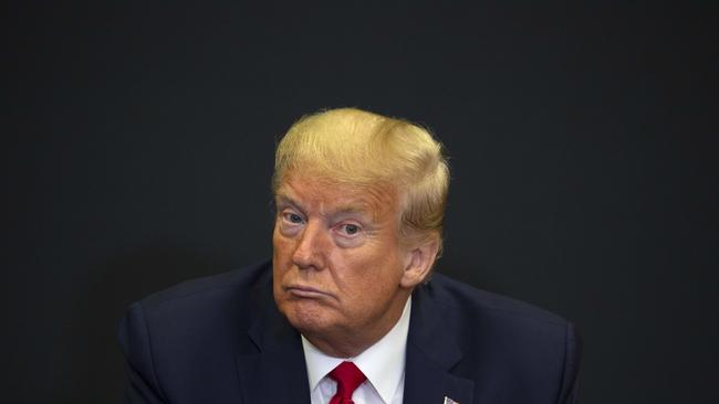 Donald Trump was at the Kennedy Space Centre as the toll passed a grim milestone. Picture: Getty Images.