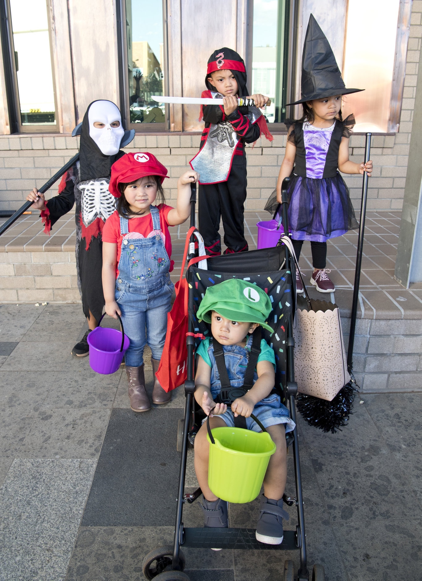 ( Back from left ) Kiel Rodriguez, Athena Baluyut, Kenn Corpuz and Yzabella Corpuz. ( In front ) Jace Baluyut. Halloween family fun event at the Toowoomba Library. Picture: Nev Madsen. Saturday, 26th Oct, 2019.