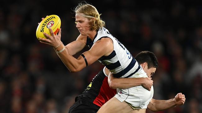 MELBOURNE, AUSTRALIA - MAY 14: Sam De Koning of the Cats is tackled by Cooper Sharman of the Saints during the round nine AFL match between the St Kilda Saints and the Geelong Cats at Marvel Stadium on May 14, 2022 in Melbourne, Australia. (Photo by Quinn Rooney/Getty Images)