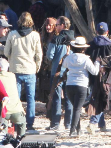 The real Johnny Depp smoking on the set of Pirates of the Caribbean: Dead Men Tell No Tales at The Spit. His body double is on the right. Pics Tim Marsden