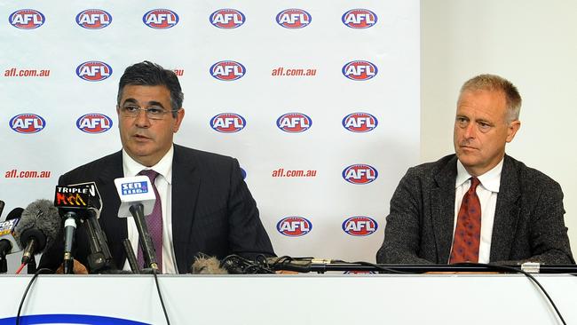 Former AFL CEO Andrew Demetriou (left) and AFL Medical Officer Dr Peter Harcourt in 2013. Picture: AAP Image/Joe Castro