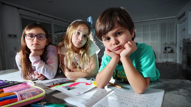 Children in Melbourne, Olivia 7, Annalise 9 and George 5, had to learn from month for months and were well and truly sick of it. Picture Rebecca Michael.