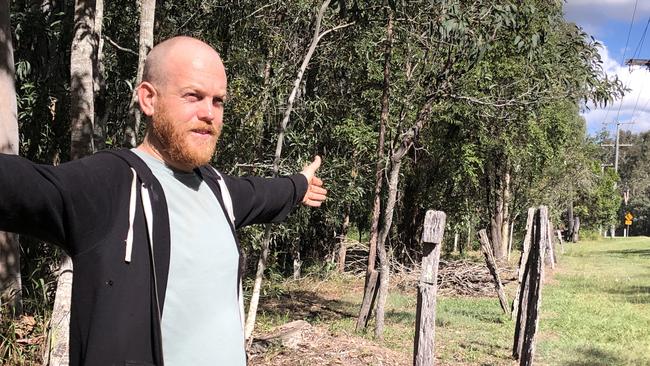 Chambers Flat Rd resident Anthony Aitken at the front of his property which Logan City Council will resume to widen the road. PHOTO: JUDITH KERR