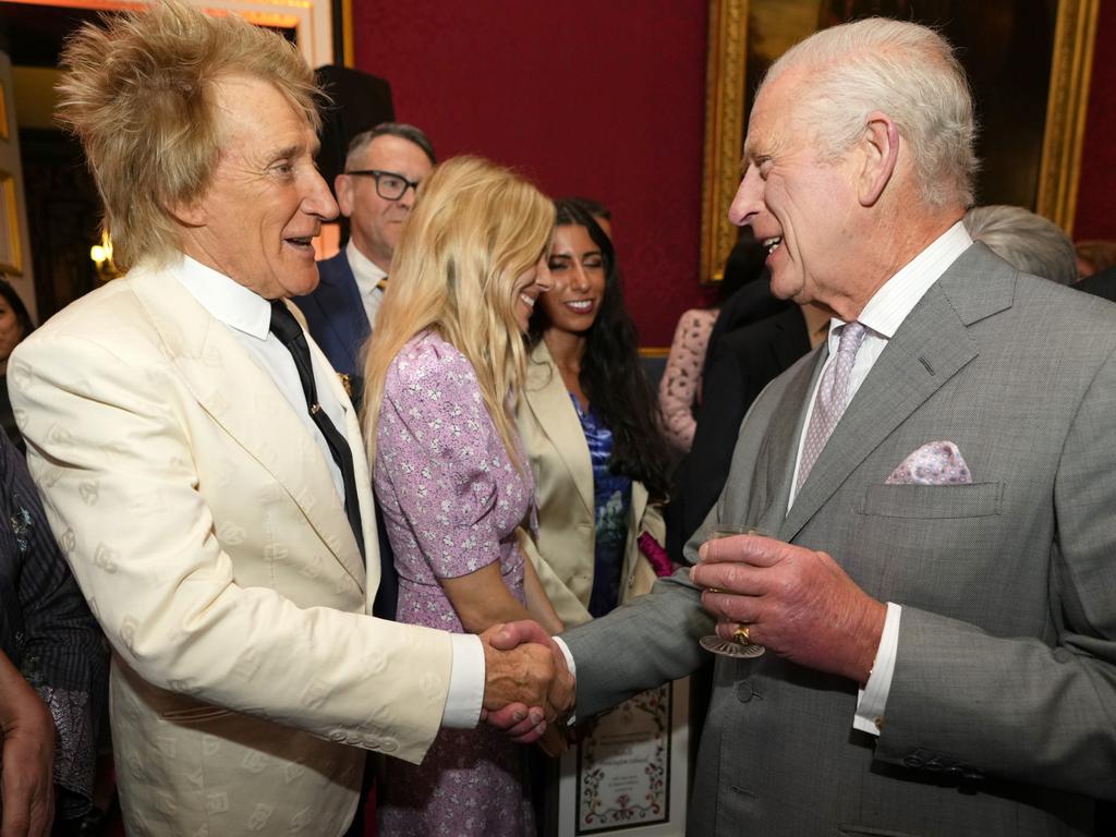 King Charles III, right, shakes hands with British pop icon Rod Stewart as they attend the inaugural King's Foundation charity awards at St James's Palace in London. Picture: Getty Images