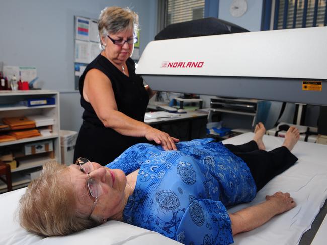 Radiographer Irene Zommers performs a bone density scan for osteoporosis on patient Margaret Pascoe at the Royal Adelaide Hospital.