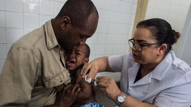 Vaccines have been saving children the world over for decades. In Sao Paulo, Brazil, a little boy is vaccinated against yellow fever. (Pic: Nelson Almeida/AFP)