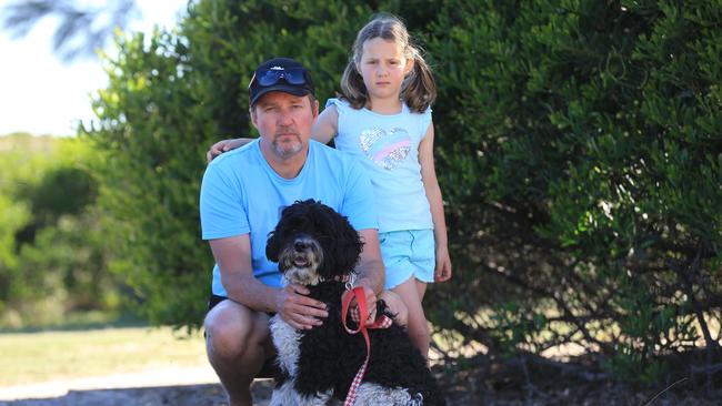 Darren Watkins with six year old daughter Zoe Watkins and labradoodle. The family were left traumatised after a dog attack in Torquay. Picture: Peter Ristevski