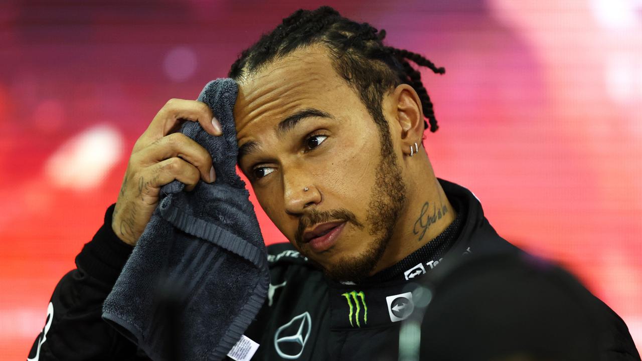 ABU DHABI, UNITED ARAB EMIRATES - DECEMBER 12: Second placed and championship runner up Lewis Hamilton of Great Britain and Mercedes GP looks dejected in parc ferme during the F1 Grand Prix of Abu Dhabi at Yas Marina Circuit on December 12, 2021 in Abu Dhabi, United Arab Emirates. (Photo by Bryn Lennon/Getty Images) *** BESTPIX ***