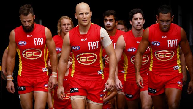 Gary Ablett leads his teammates onto the MCG. Picture: Michael Klein