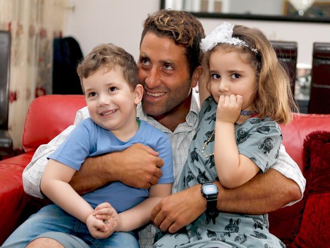 Ali Zeid al-Amine poses with Noah and Lahela, who are at the centre of the abduction controversy. Picture: Reuters/Mohamed Azakir.