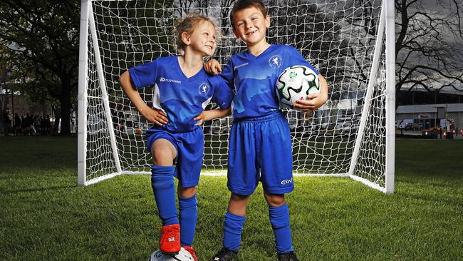 Soccer players from the Lindisfarne Soccer Club, Maci, 6 and her brother Xavier Clark, 7 on parliament Lawns. Picture: Zak Simmonds