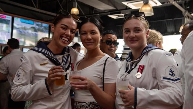 Chloe Bradshaw, Emily Mason and Hayley Walker as ADF personnel crowd into Darwin pubs to celebrate Anzac Day. Picture: Pema Tamang Pakhrin