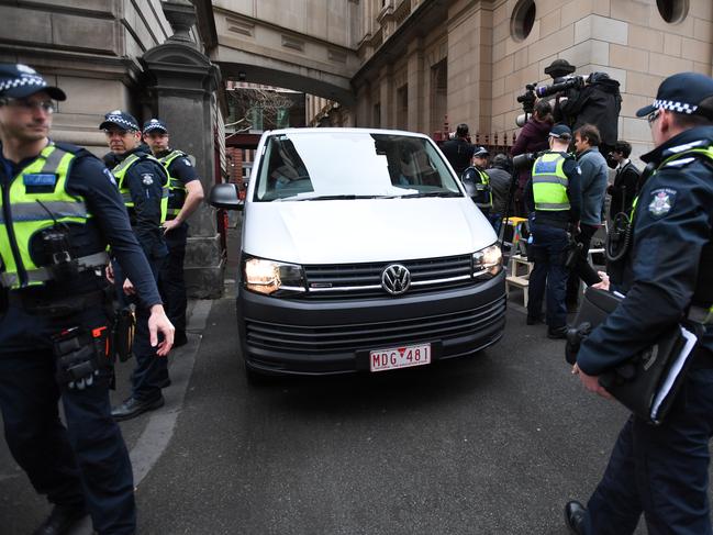 A van arrives with Cardinal George Pell at the Supreme Court. Picture: Erik Anderson/AAP