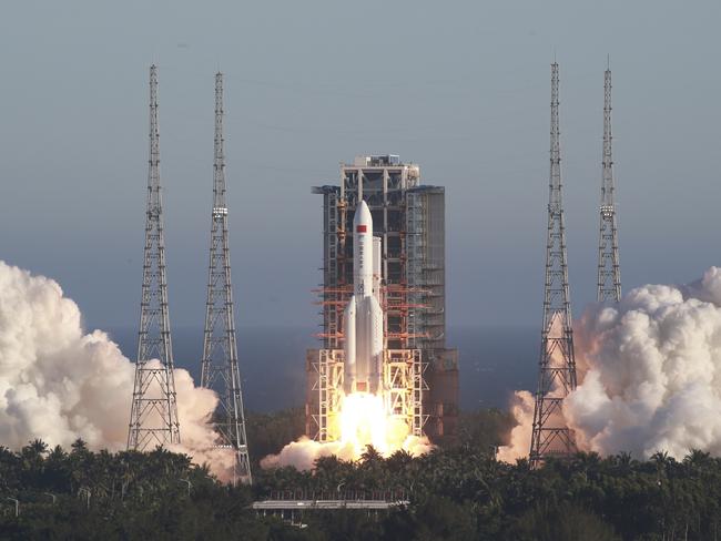 In this photo released by Xinhua News Agency, China's new large carrier rocket Long March-5B blasts off from the Wenchang Space Launch Center in southern China's Hainan Province, May 5, 2020. The Long March-5B made its maiden flight on Tuesday, sending the trial version of China's new-generation manned spaceship and a cargo return capsule for test into space. (Tu Haichao/Xinhua via AP)