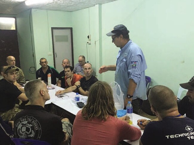 Richard Harris briefing the team on anaesthesia during the Thai cave rescue. Image taken from the book 'Against the Odds' by Richard Harris and Craig Challen.