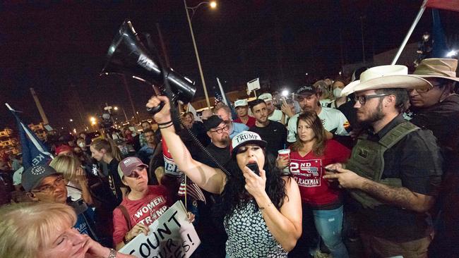 Trump supporters gather in front of the Maricopa County Election Department where voter ballots were counted after the US presidential election in Phoenix, Arizona.