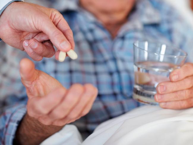 Closeup of a senior man being given a life saving pill, Patient, Senior Adult, Medicine, Taking Medicine, Adult, Adults Only, Background, Bed, Blur, Care, Citizen, Close-Up, Colour Image, Drinking Water, Focus, Grandfather, Healthcare And Medicine, Holding, Horizontal, Human Age, Human Hand, Illness, Lifestyles, Males, Mature Adult, Men, People, Photography, Pill, Portrait, Prescription Medicine, Retirement, Room, Saving, Serene People, Sleeping, Sleeping Pill, Smiling, The Ageing Process, Treatment, Water, thinkstock, istock, generic