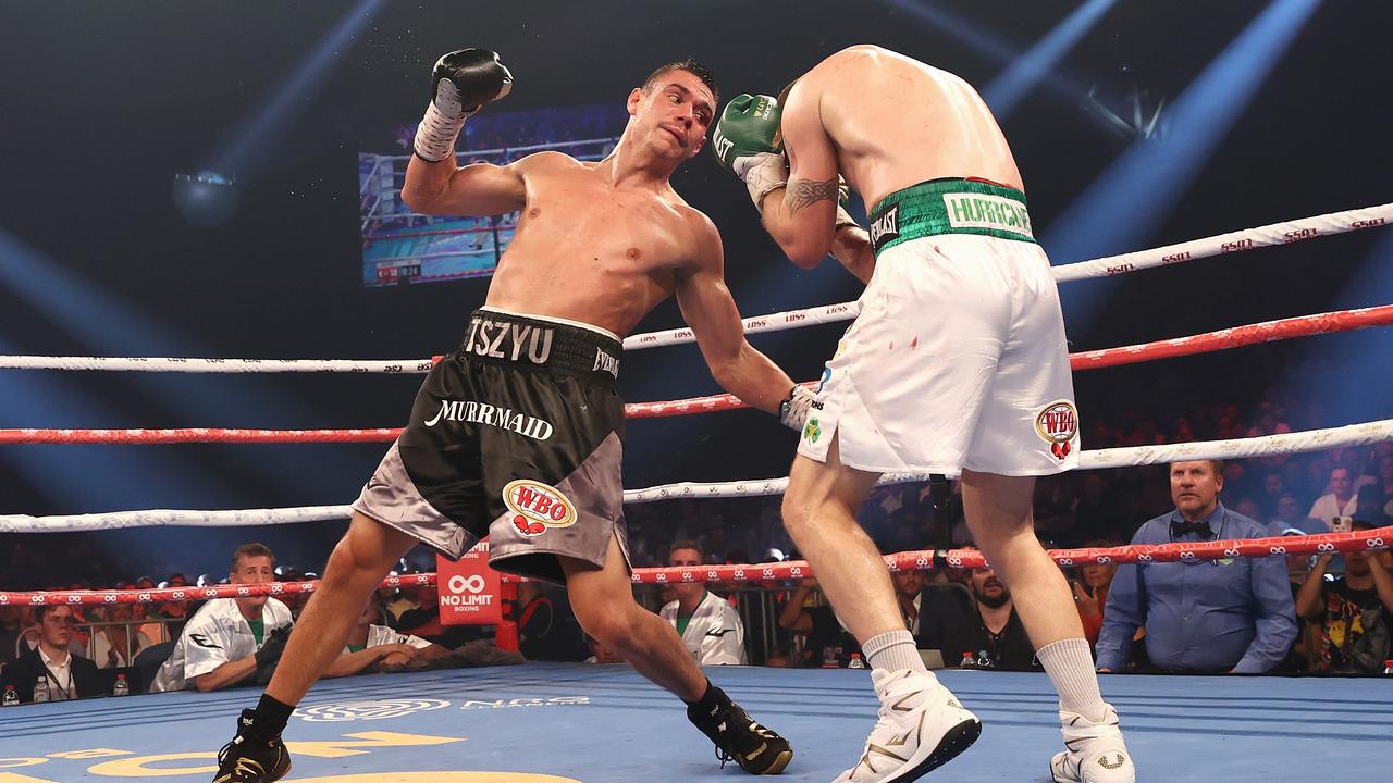 Tim Tszyu delivers a left rip to Dennis Hogan. (Photo by Cameron Spencer/Getty Images)