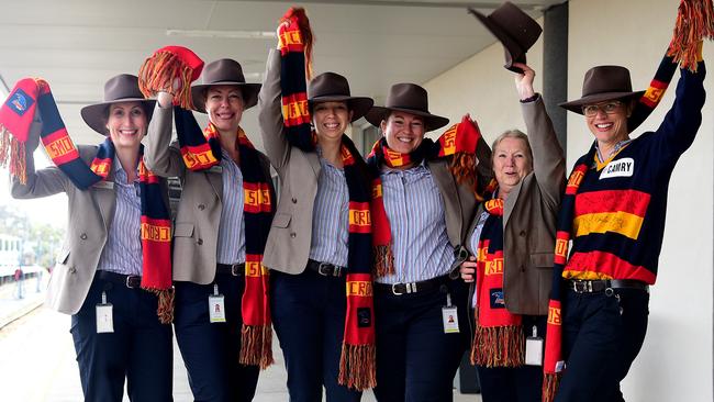 Great Southern Rail staff Anna Howe, Viki Pinter, Brittney Howe, Georgina Norsworthy, Julie Sleep and Susan Allen cheer on as fans leave for Melbourne aboard the 'Crowverland’. Picture: Bianca De Marchi