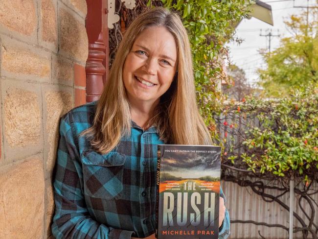 Author Michelle Prak and her book ÃThe RushÃ at her West Croydon home. Pictured on September 7th 2023. Picture: Ben Clark