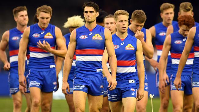 Easton Wood leads the Bulldogs off after losing to West Coast.