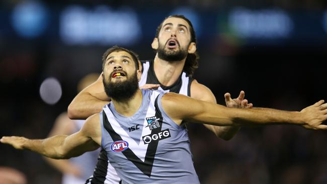 Paddy Ryder of the Power and Collingwood's Brodie Grundy battle. Pic: Michael Klein.