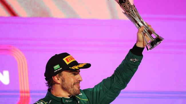 Fernando Alonso celebrated on the podium after his third-placed finish, but was forced to hand the trophy back just moments later. Picture: Getty Images