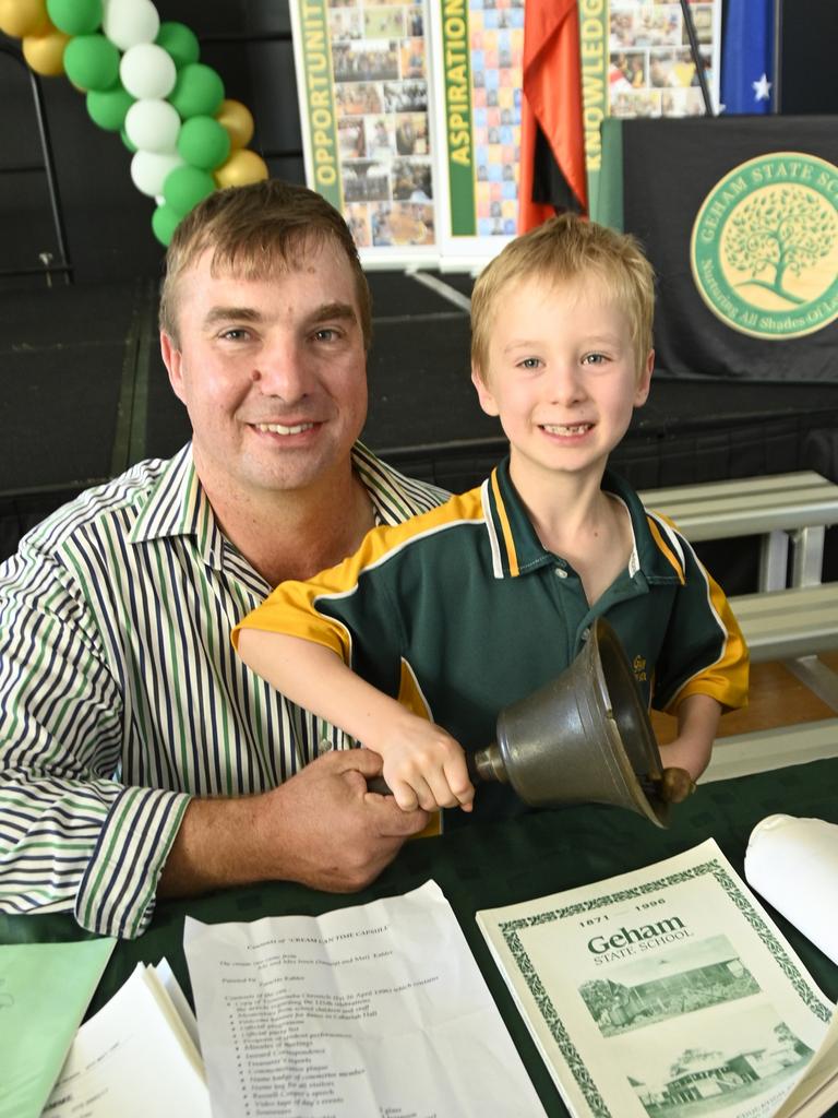 Geham State School celebrate 150th anniversary. Past student, John Welke and his son Samuel Welke, currently in year 2 look through items after the opening of the time capsule from the school's 125th anniversary.