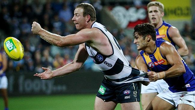 Geelong star Steve Johnson dishes off a handball. Picture: Colleen Petch