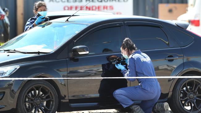 Police were still collecting evidence well into Sunday afternoon. Picture: David Crosling