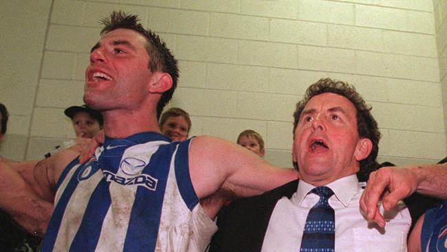 Corey McKernan and Denis Pagan celebrate a Kangaroos win in 1999.