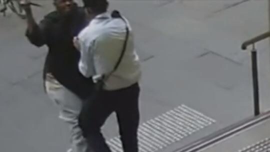 New CCTV footage shows a security guard being stabbed in the neck by assailant Hassan Khalif Shire Ali during the Bourke St attack. Picture: Nine News