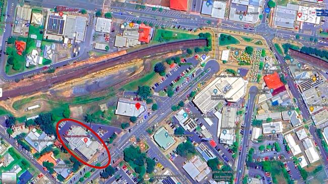 A red ring around the building that TMR will demolish to build a train station carpark and where Graeme Morris owns a dental prosthetics practice.