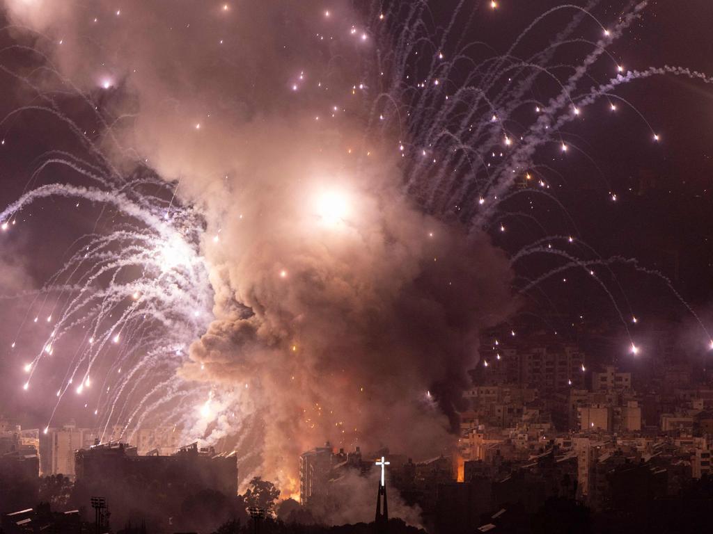 This show captured the moment smoke rises from the site of an Israeli airstrike that targeted a neighborhood in Beirut’s southern suburbs, late on October 6, 2024. Picture: AFP