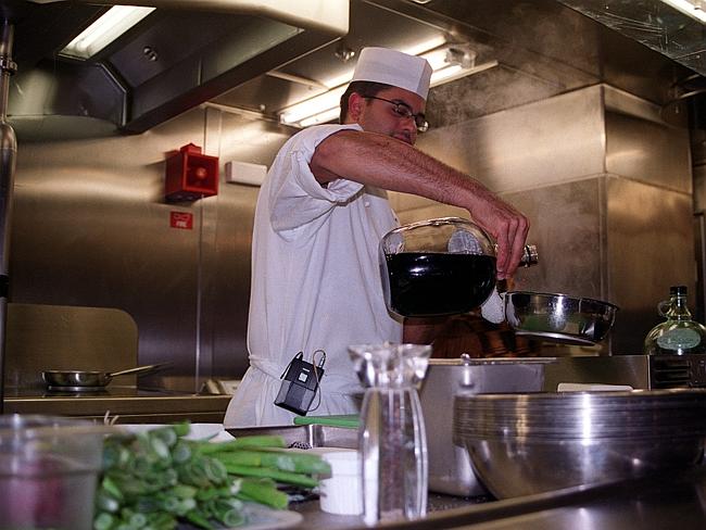 Cooking in the kitchen of the cruise ship Queen Mary 2.