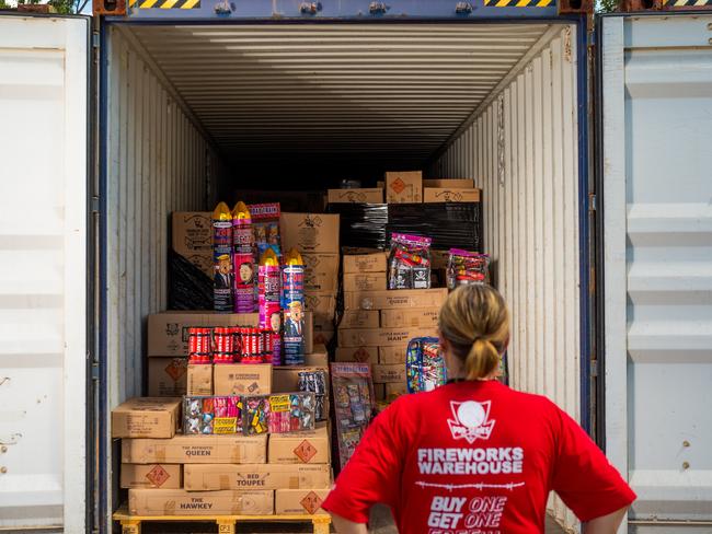 <s1>A Fireworks Warehouse employee with one of three containers of fireworks. Picture: Che Chorley</s1>