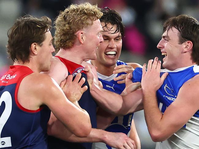 MELBOURNE, AUSTRALIA - JUNE 22:  Clayton Oliver of the Demons and George Wardlaw of the Kangaroos wrestle during the round 15 AFL match between Melbourne Demons and North Melbourne Kangaroos at Melbourne Cricket Ground, on June 22, 2024, in Melbourne, Australia. (Photo by Quinn Rooney/Getty Images)