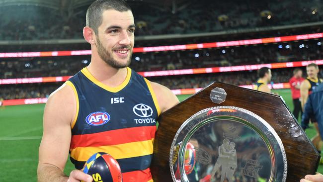 Taylor Walker of the Crows with the Showdown shield earlier this month. Picture: AAP Image/David Mariuz