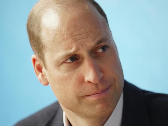 BIRKENHEAD, UNITED KINGDOM Ã¢â¬â JANUARY 12:  Prince William, Prince of Wales listens to staff as he and Catherine, Princess of Wales (not pictured) visit the Open Door Charity, a charity focused on supporting young adults across Merseyside with their mental health, using culture and creativity as the catalyst for change, at the charityÃ¢â¬â¢s flagship Bloom Building on January 12, 2023 in Birkenhead, England. The Prince and Princess of Wales are visiting Merseyside to thank those working in healthcare and mental health support for their work during the winter months. Their engagements take place 2 days after the official release of Prince Harry, Duke of Sussex's book "Spare".  (Photo by Jon Super-WPA Pool/Getty Images)