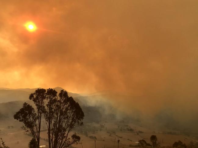 EMBARGO SUNDAY OCT 3 :  Fighting Spirit: a book commemorating the Black Summer bushfires and charting the recovery process:    Photo submitted for inclusion in Fighting Spirit bushfire book. Looking over Naas Valley at the escalating Orroral Valley fire at Mount Tennent, NSW, Jan 31 2019. By Kate Hudson (NSW)