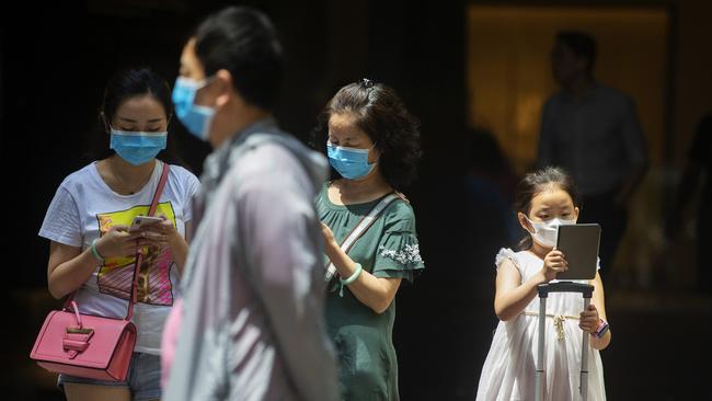 People wearing masks in Sydney's CBD on Friday. Picture: Getty Images