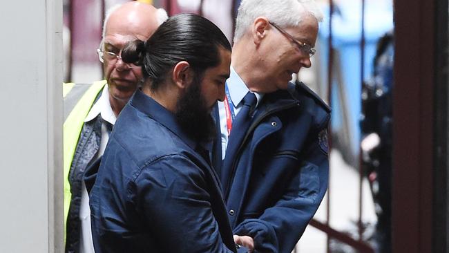 Murat Kaya, accused of playing an instrumental role in the "tinnie terror" plot, arrives at the Supreme Court in Melbourne, Thursday. Nov. 24, 2016. Plumpton father Murat Kaya, 25, is seeking to be bailed on the charge of making preparations for incursions into a foreign county, initially named by police as Syria and which his barrister Michael Tovey QC says can no longer be made out. (AAP Image/Tracey Nearmy) NO ARCHIVING