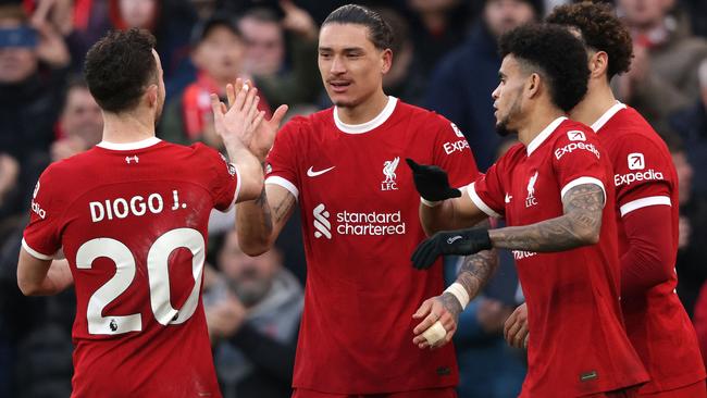 Liverpool's Uruguayan striker #09 Darwin Nunez (2L) celebrates scoring the team's third goal with Liverpool's Portuguese striker #20 Diogo Jota (L) during the English Premier League football match between Liverpool and Burnley at Anfield in Liverpool, north west England on February 10, 2024. (Photo by Ian Hodgson / AFP) / RESTRICTED TO EDITORIAL USE. No use with unauthorized audio, video, data, fixture lists, club/league logos or 'live' services. Online in-match use limited to 120 images. An additional 40 images may be used in extra time. No video emulation. Social media in-match use limited to 120 images. An additional 40 images may be used in extra time. No use in betting publications, games or single club/league/player publications. /